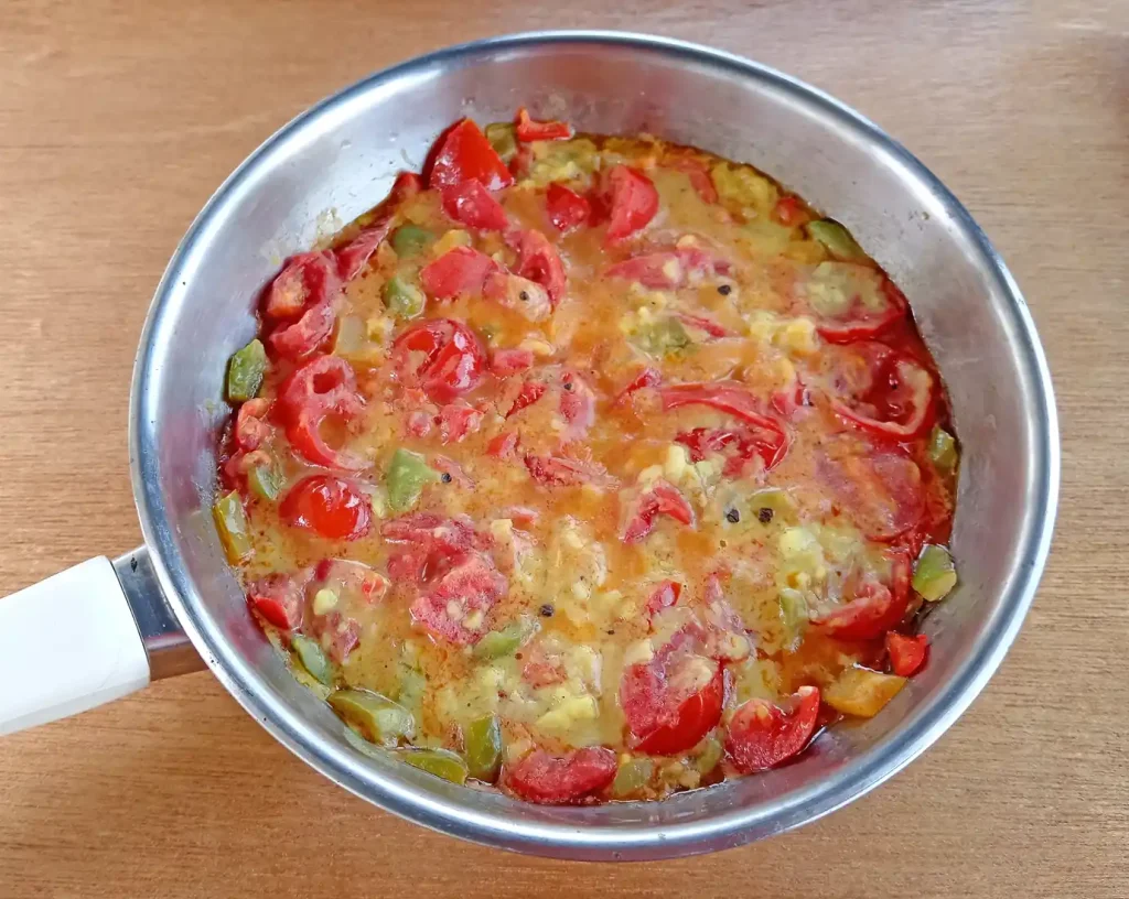 delicious vegan menemen is served in a steel pan